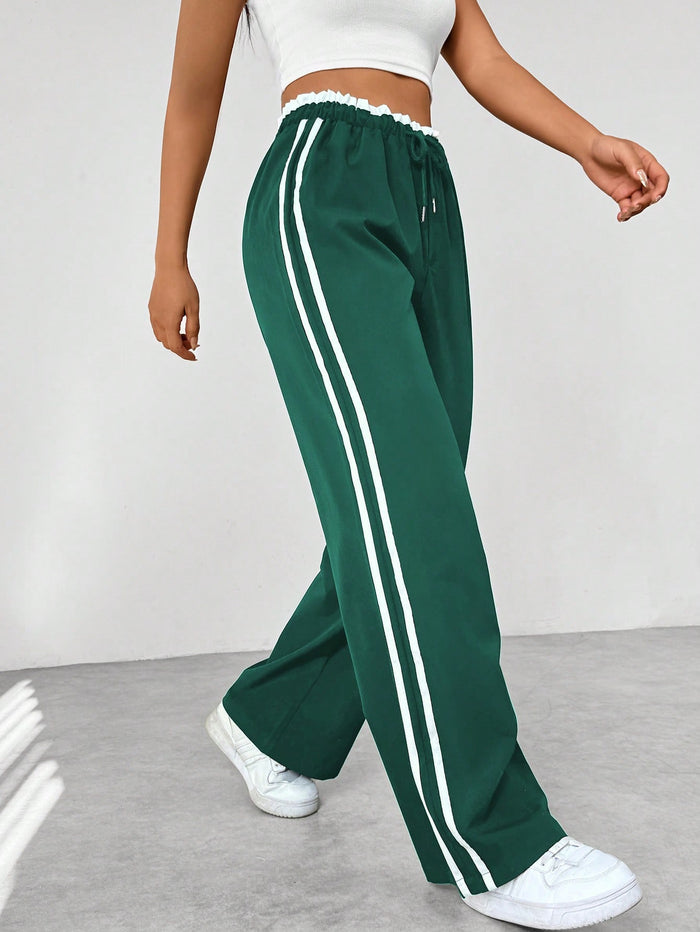 Sofía | Pantalones Deportivos de Talle Alto para Mujer con Rayas Blancas y Cintura Elástica 1