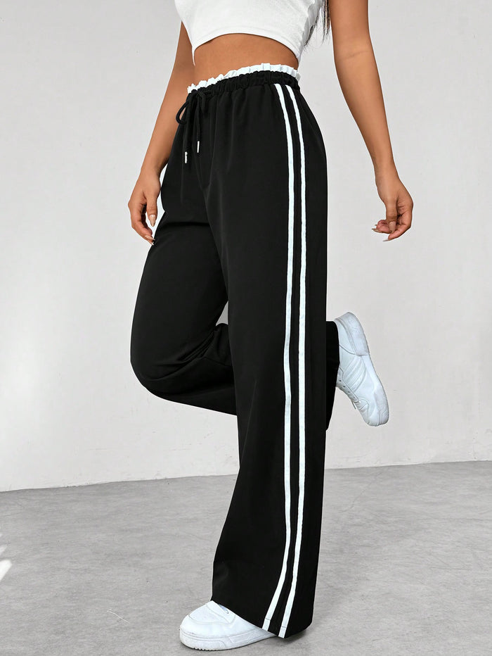 Sofía | Pantalones Deportivos de Talle Alto para Mujer con Rayas Blancas y Cintura Elástica 2