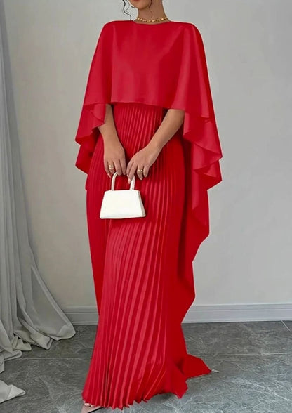 Mujer luciendo el vestido formal AURELIA con mangas murciélago