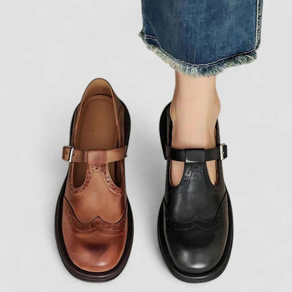 Botines de piel estilo vintage combinados con falda midi