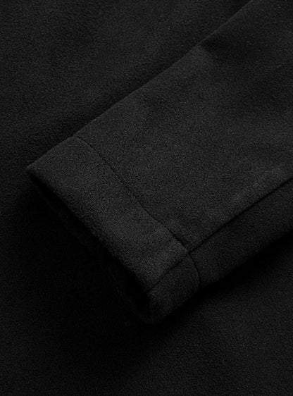 Detalle del tejido de lana del abrigo entallado CORVENT en negro