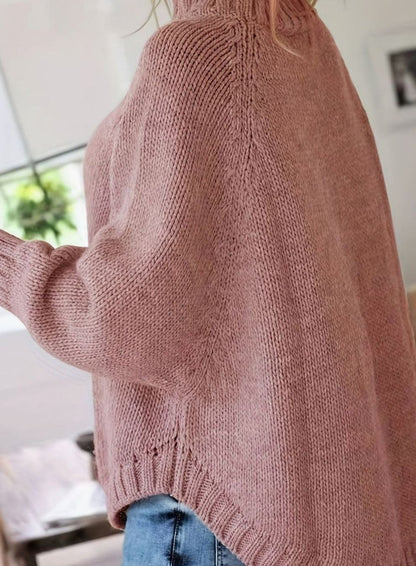 Jersey oversize negro de punto trenzado con cuello alto