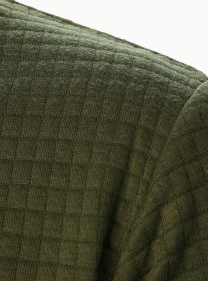 Cazadora bomber FERRIK doblada mostrando textura de rejilla