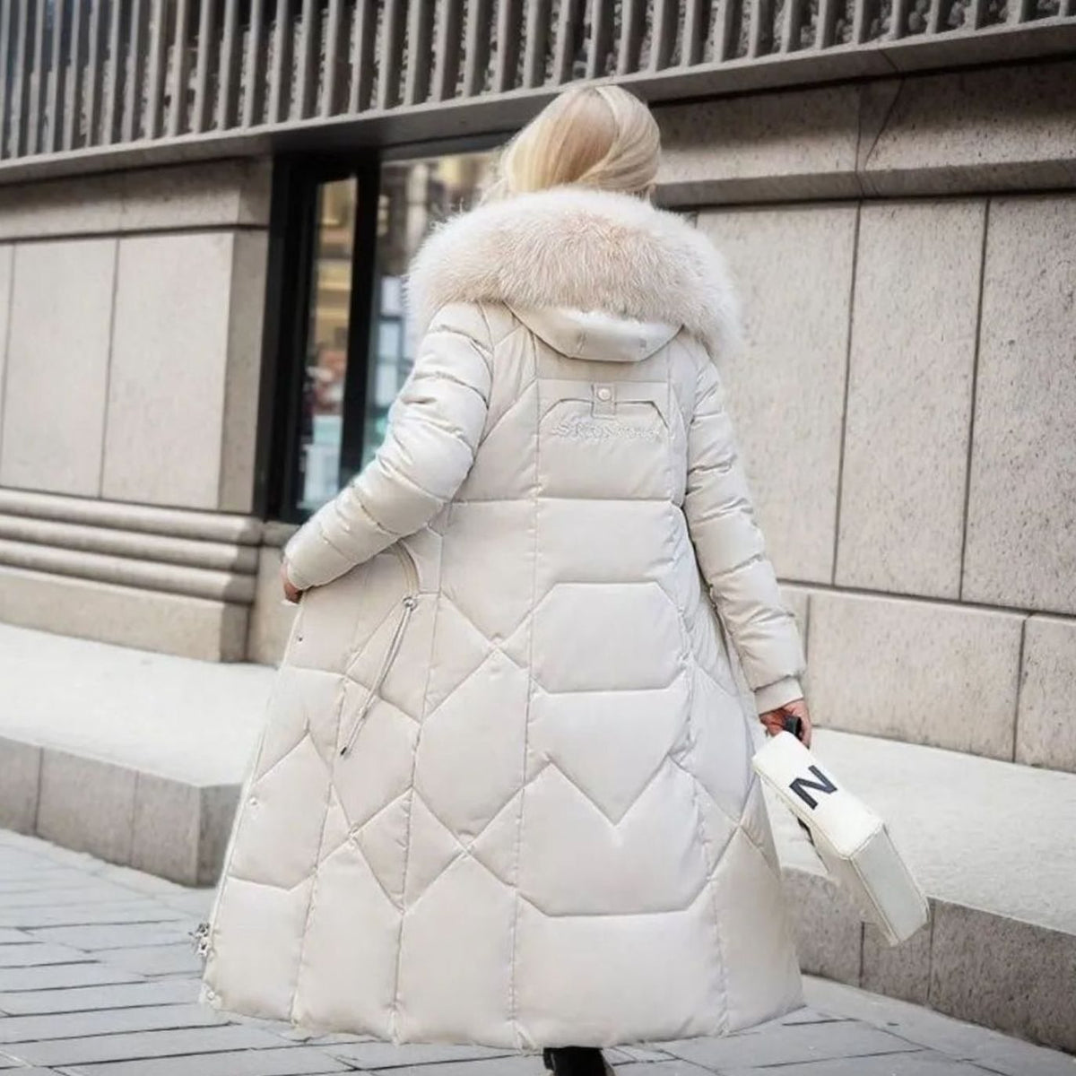 Abrigo acolchado en capitoné hasta la rodilla para mujer