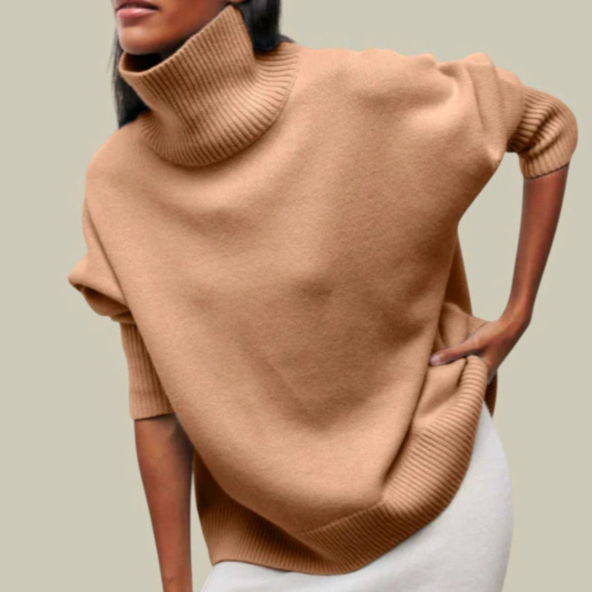 Vista trasera del jersey de punto oversized con caída relajada