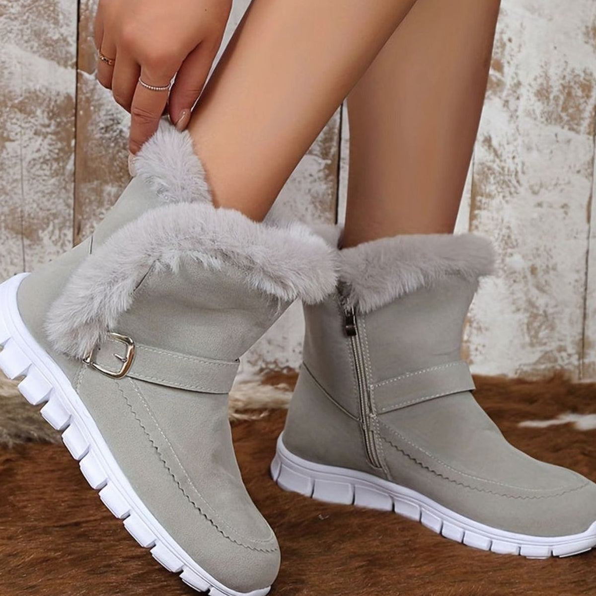 Botines de nieve combinados con vaqueros para look invernal
