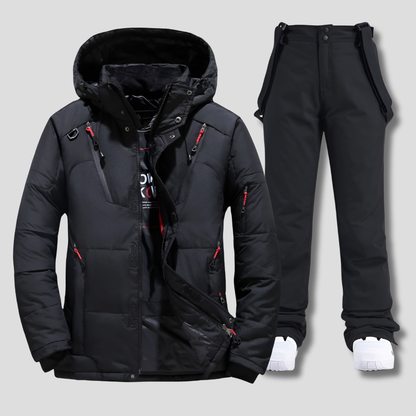 Hombre con conjunto de esquí NORDVIK impermeable en la nieve