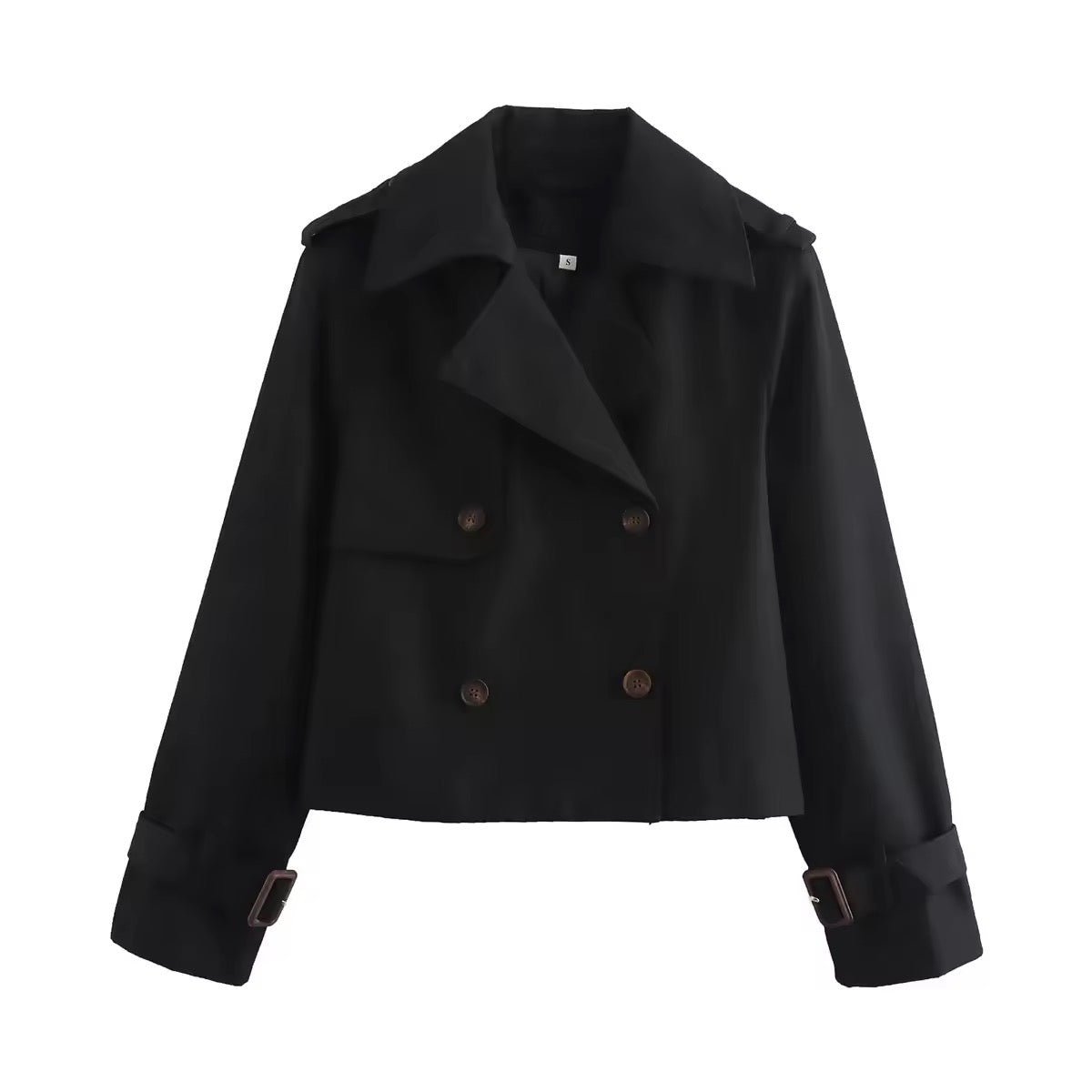 Detalle de los puños con hebilla ajustable de la gabardina