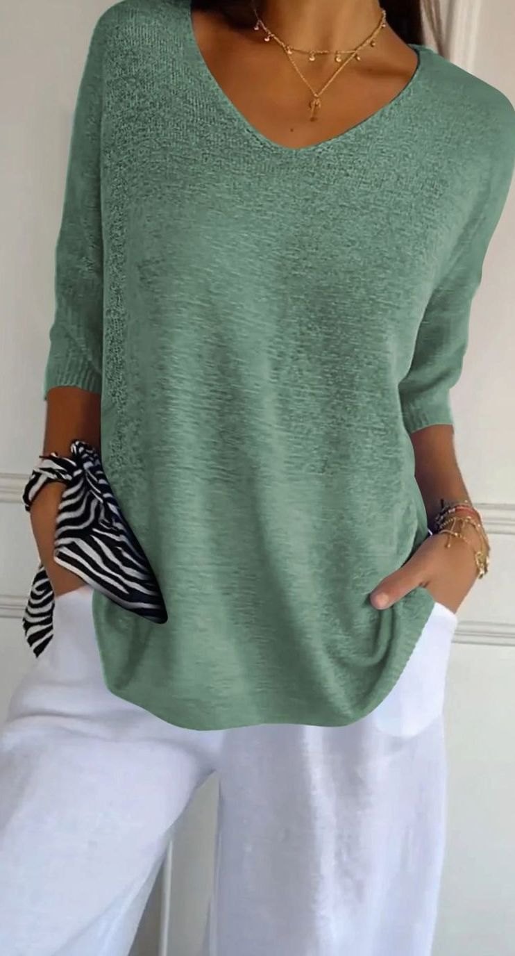 Túnica de punto longline combinada con pantalón vaquero