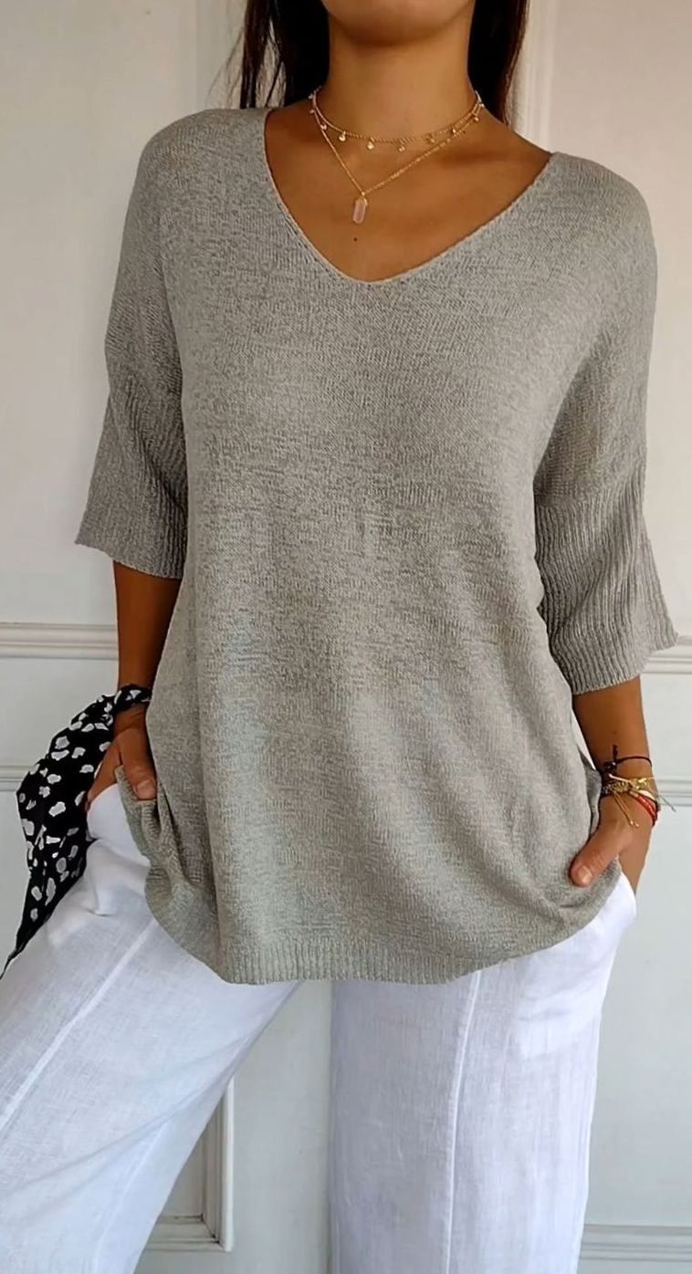 Túnica de punto de mujer en look de entretiempo con capa adicional