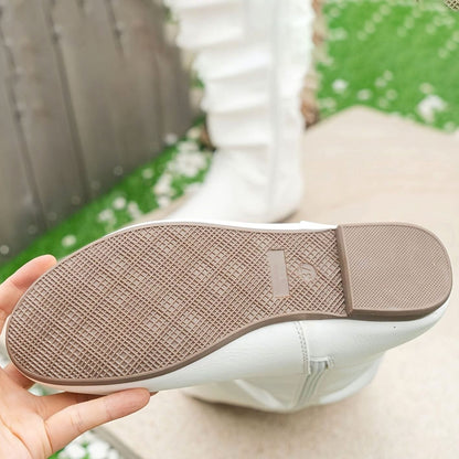 Botas planas de mujer en color negro con caña fruncida
