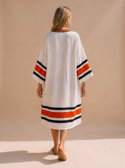Vestido kaftán midi con ribetes de rayas negras y naranjas en mangas y bajo