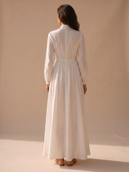 Vestido maxi TESSALYN visto de perfil mostrando la caída de la falda